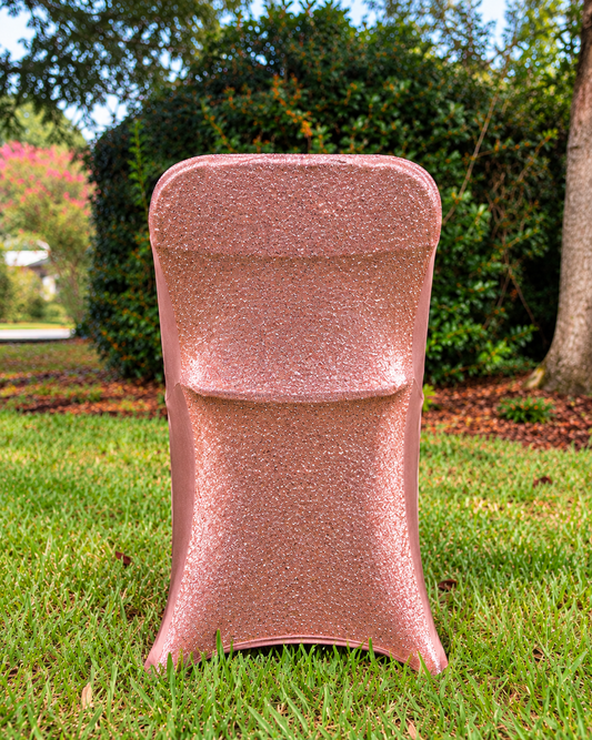 Rose gold metallic shimmer chair cover in garden setting; styled product visualization