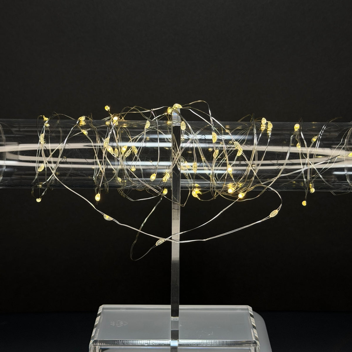 Warm white music-sync fairy lights illuminated on clear display