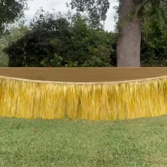 Gold, metallic, tinsel, fringe banner blowing in the wind video
