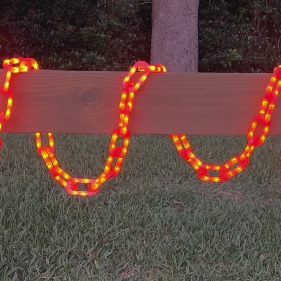 String of Chains Lights in orange cycling through light sequences wrapped around a centerboard