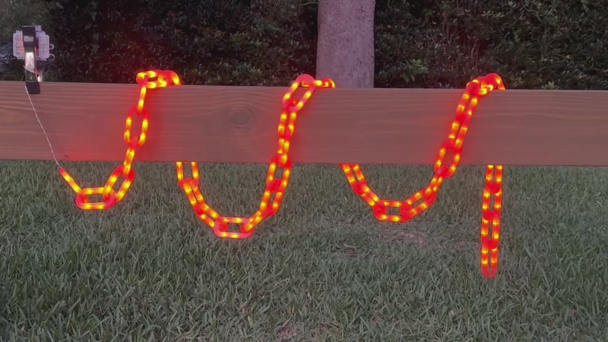 String of Chains Lights in orange cycling through light sequences wrapped around a centerboard